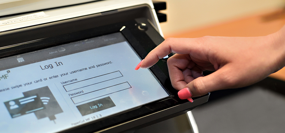 Copy Services women's hand at copier panel